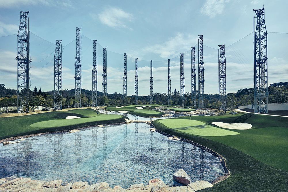 Flagstaff Synthetic grass golf course with water and tall metal towers