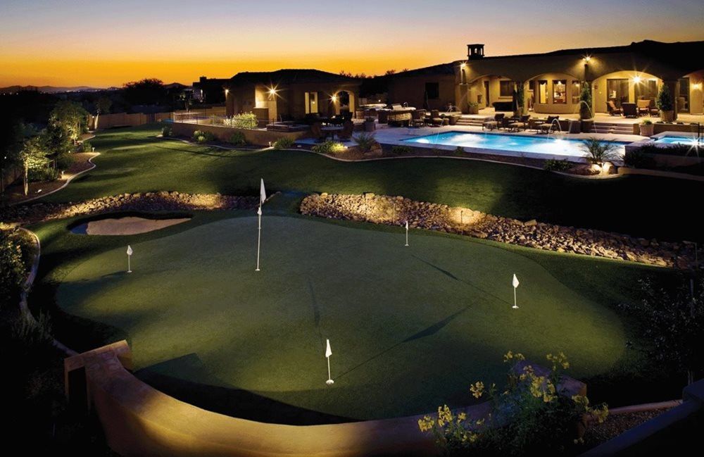Flagstaff residential backyard putting green grass